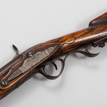 a 18th century rifle later made in to a percussion rifle signed by Lars Rånge, Jönköping.