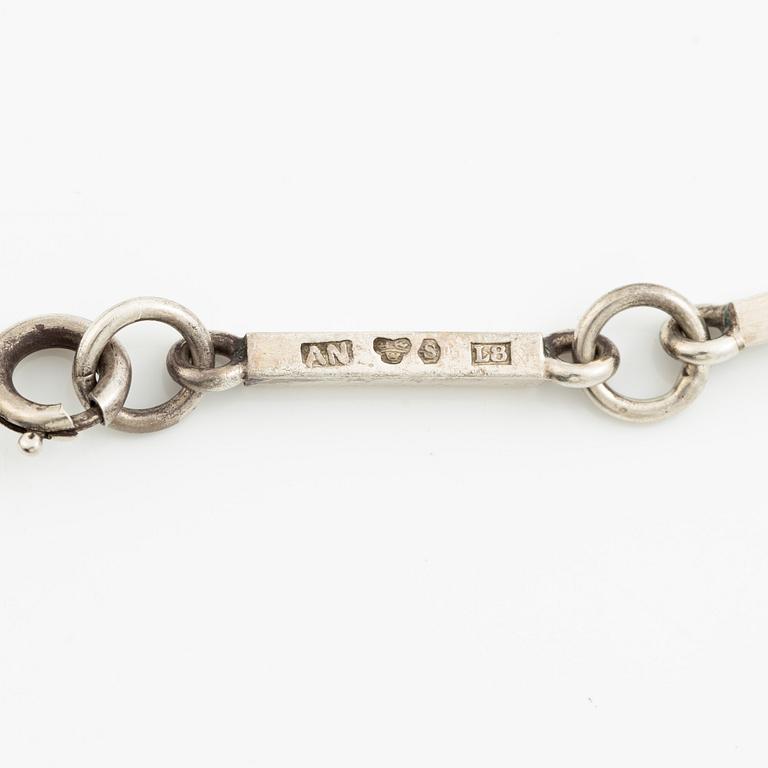 Wiwen Nilsson, a pendant in the form of a cross, sterling silver with onyx and step-cut rock crystal, Lund 1937.