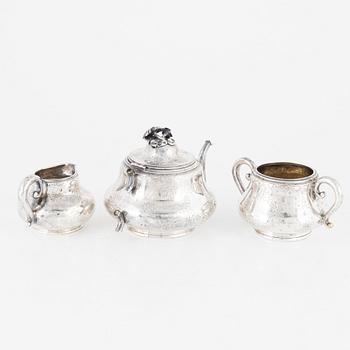 A Silver Teapot, Sugar Bowl and Creamer, France and England, 19th Century.