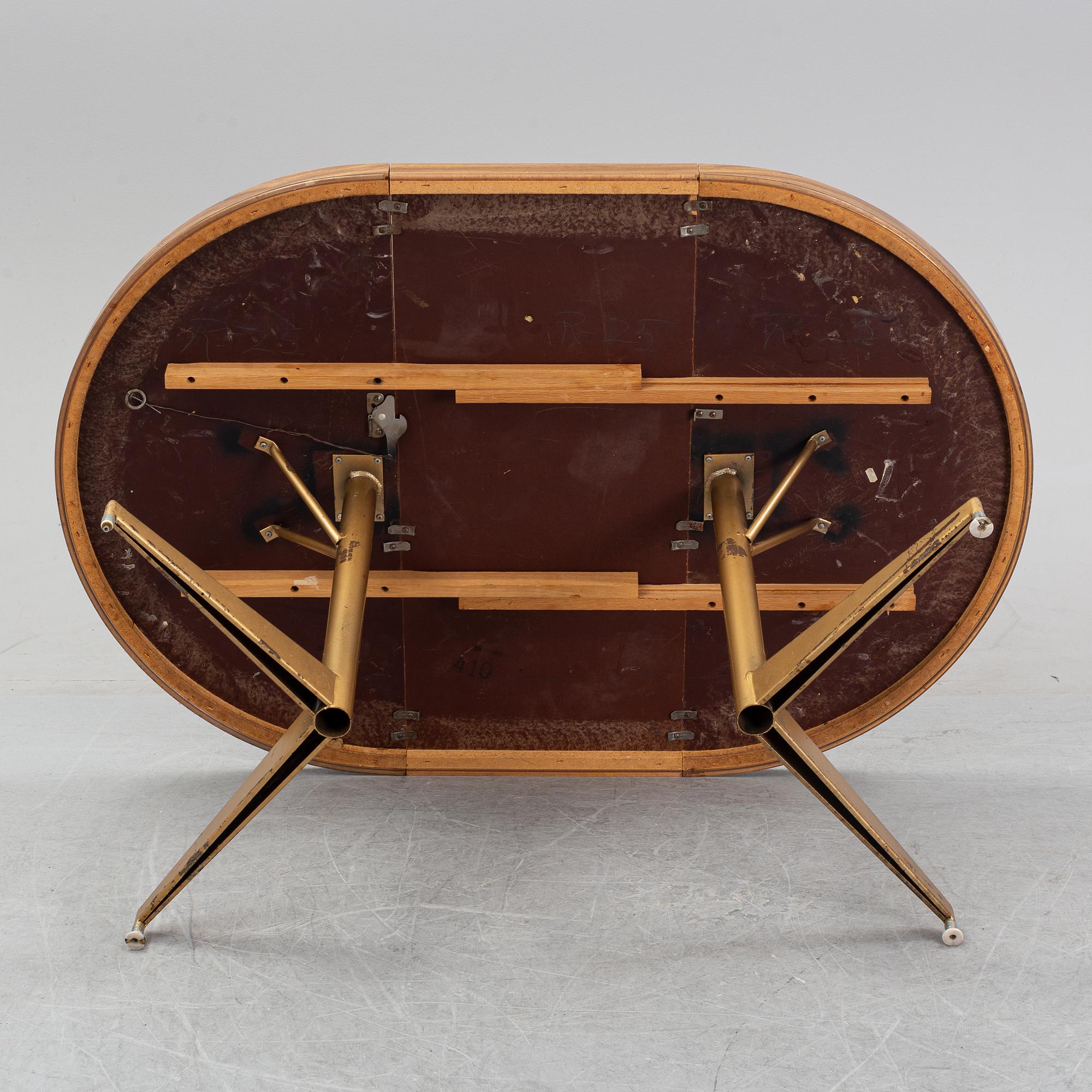 A dining table with four chairs, Walter of Wabash, table dated 1960.