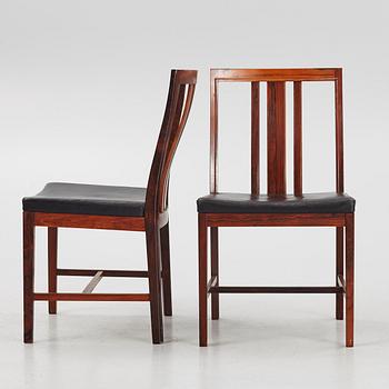 Bertil Fridhagen, a rosewood-veneered dining table with four chairs, BOdsfors, Sweden, 1960's.