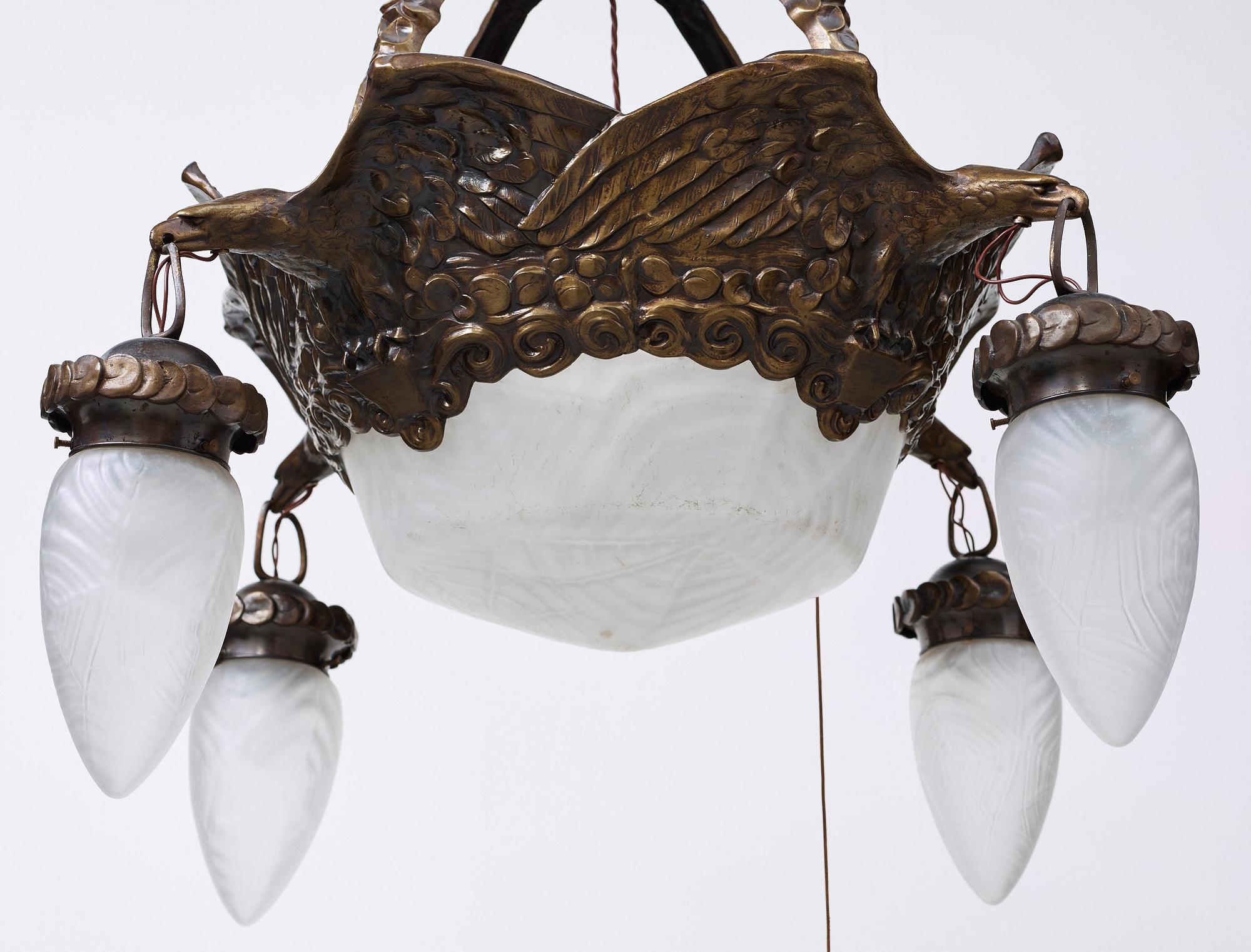 A Swedish Art Nouveau patinated brass hanging lamp attributed to Alice Nordin, Böhlmarks, Stockholm 1910's-20's.