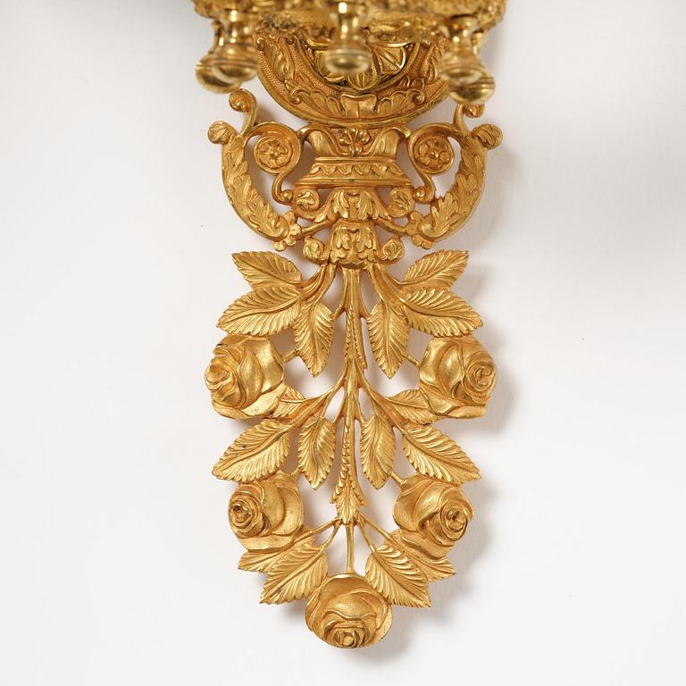 A pair of French 19th century gilt bronze five-light wall-lights.