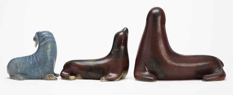 Three Gunnar Nylund stoneware figures, two seals and a walrus, Rörstrand.