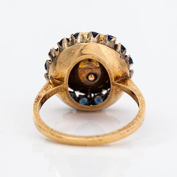 An 18K gold ring with a pearl and sapphires. Finland 1967.