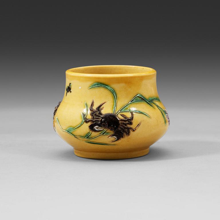 A yellow brush pot, Qing dynasty with Daoguang mark and period (1821-1850).