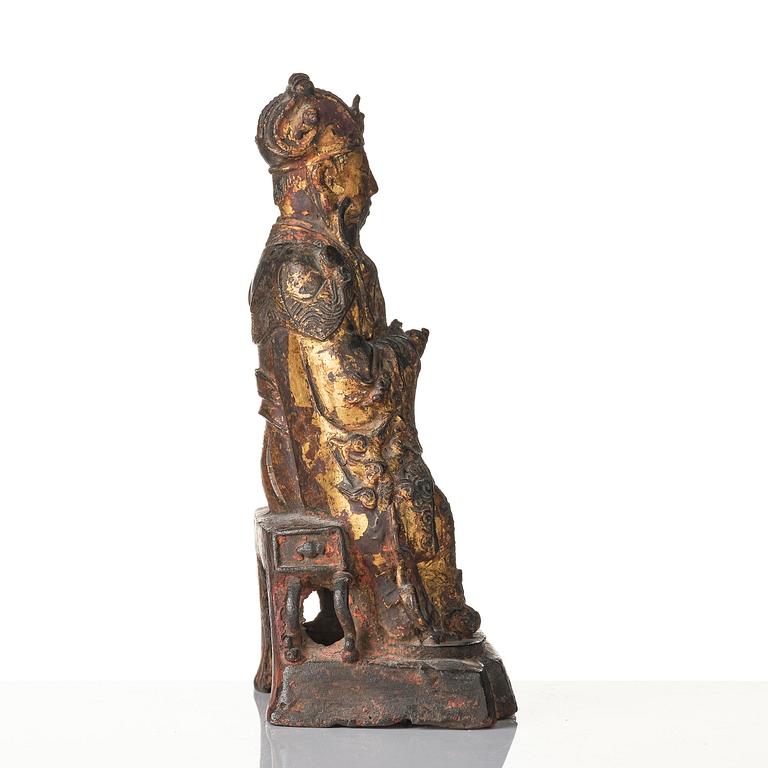 A Chinese gilt lacquered figure of a daoist deity, Ming dynasty (1368-1644).