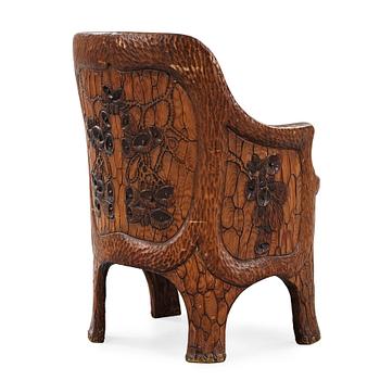 A Gustaf Fjaestad Art Nouveau carved pine chair, 'Stabbestol', by Adolf Swanson, Arvika, Sweden 1908.