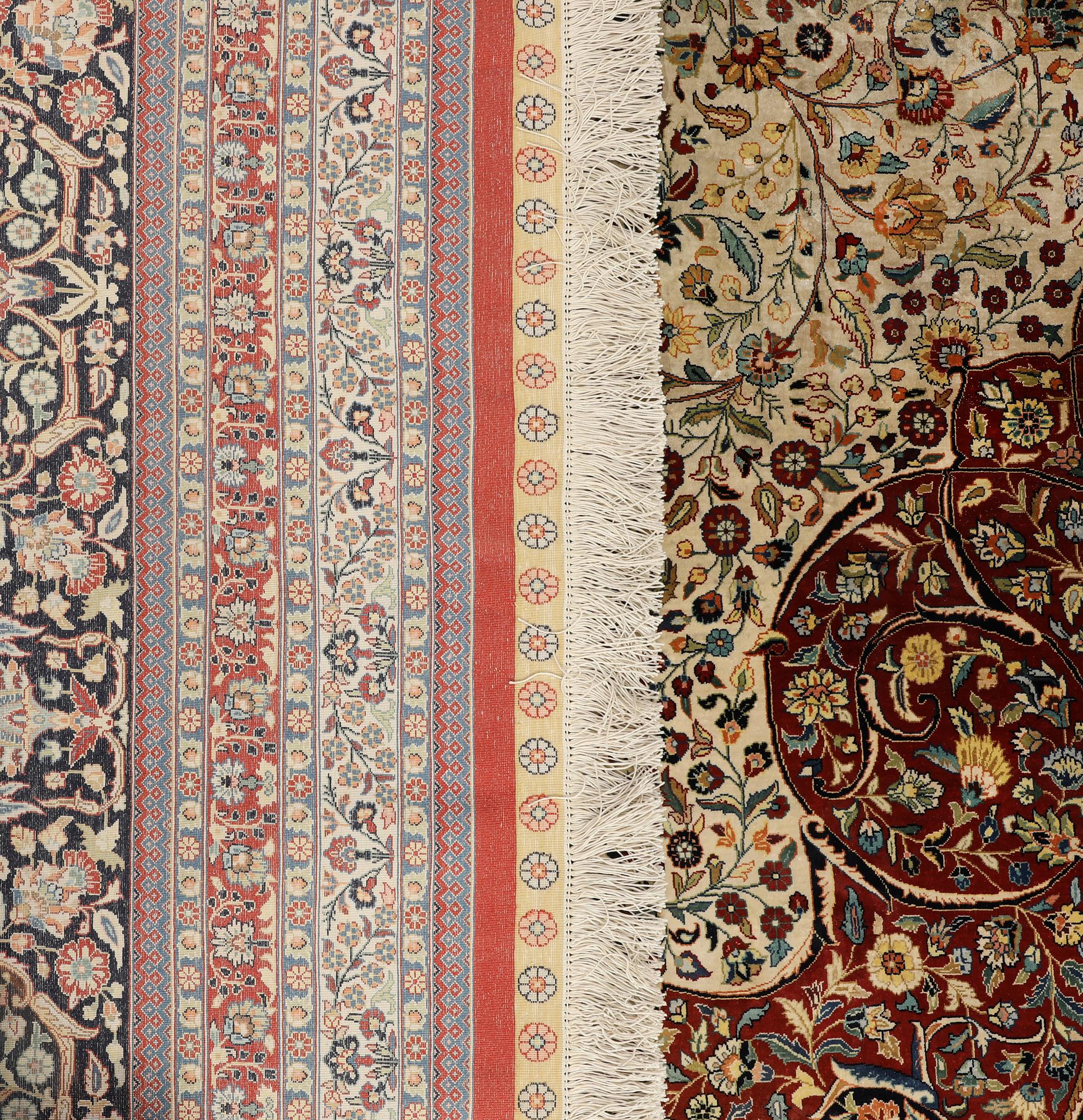 An Oriental silk carpet, c. 436 x 306 cm.