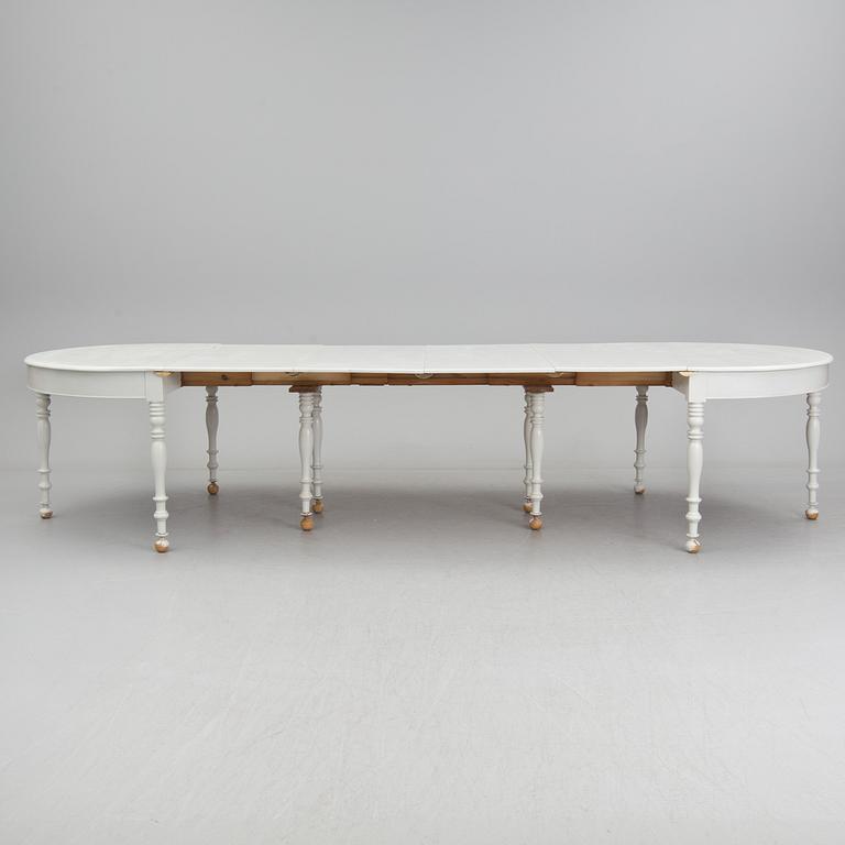 A mid 19th century dining table with six extension leaves.