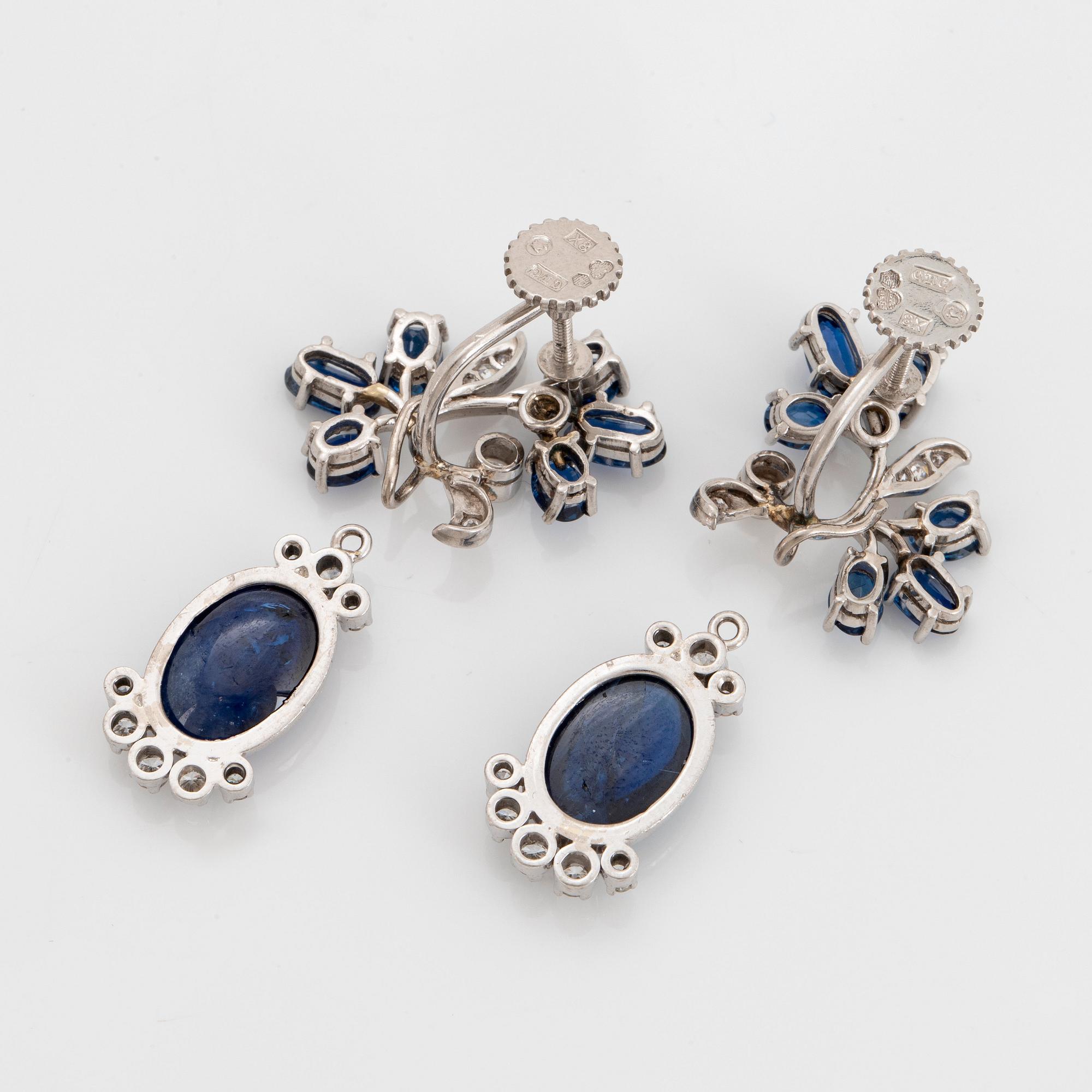 A pair of CF Carlman platinum earrings set with cabochon-cut and faceted sapphires.
