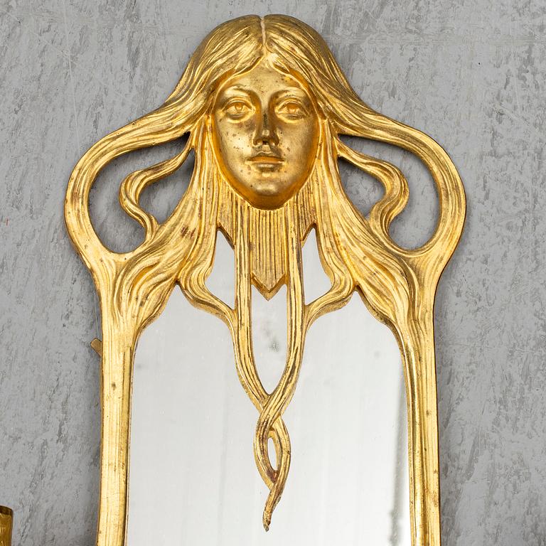 A pair of Art Nouveau mirror wall sconces, easly 20th Century.