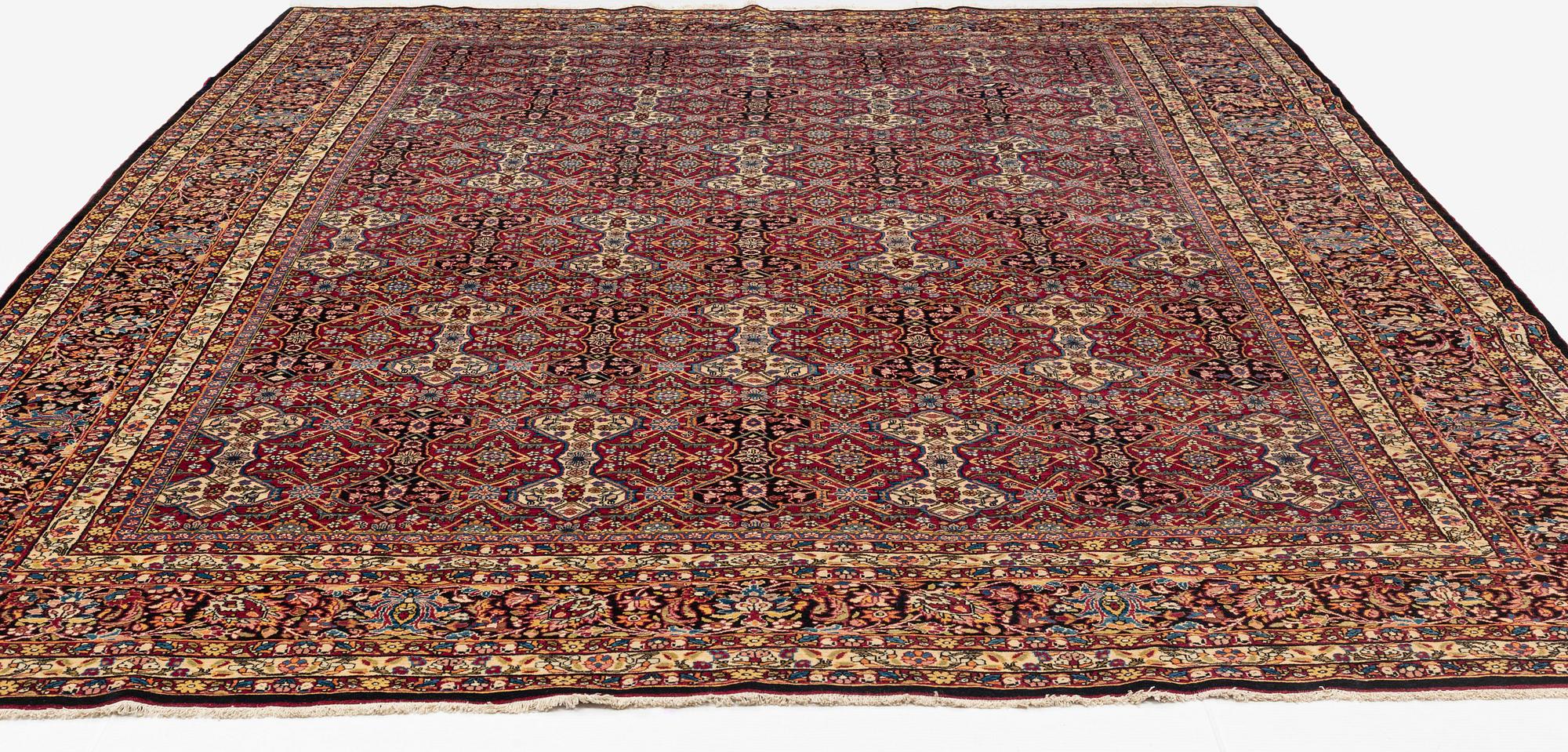 A semi-antique Semnan carpet, North Persia, c. 412 x 304 cm.