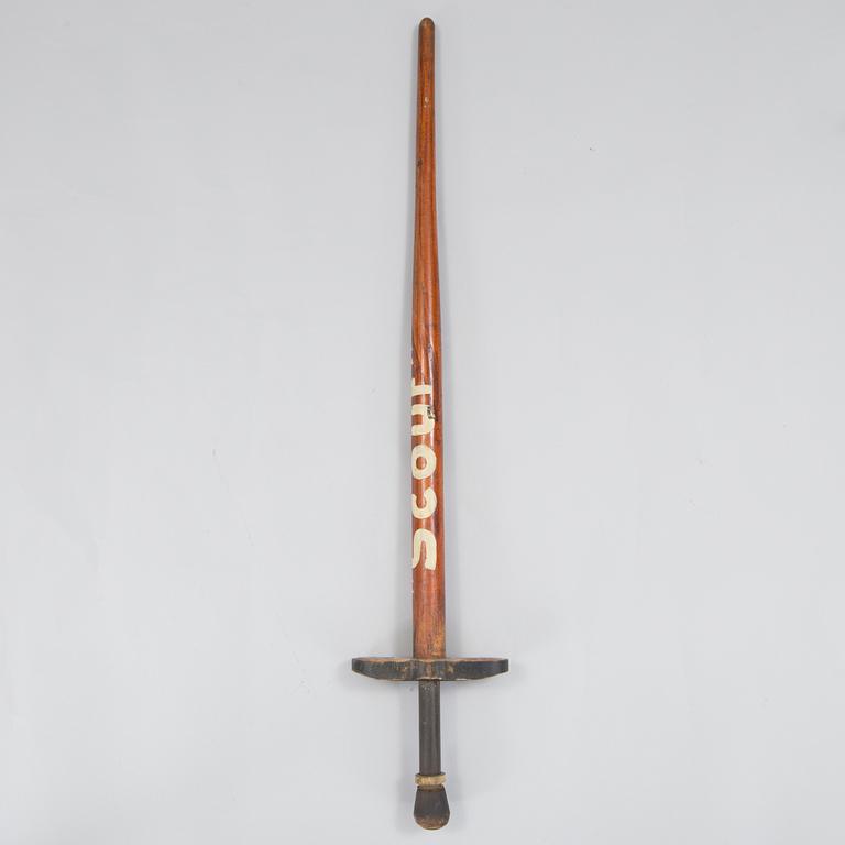 A 20th century wood pogo stick.