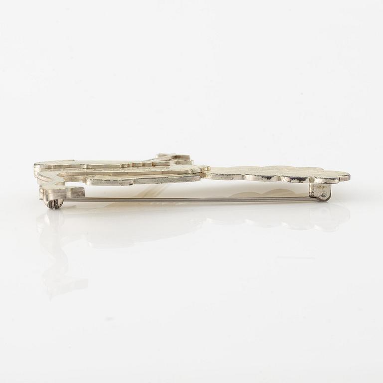 Wiwen Nilsson, a brooch, sterling silver, in the form of a peacock, Lund 1959.