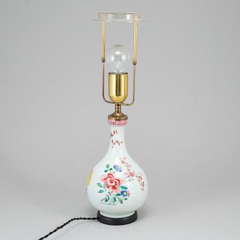 A famille rose bottle vase, Qing dynasty, 18th Century. Mounted as a lamp.
