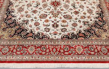 A silk Ghom carpet, 295 x 195 cm.