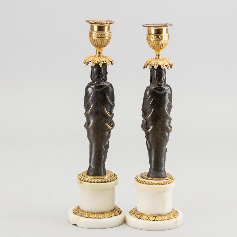 A pair of Louis XVI 18/19 century candlesticks.