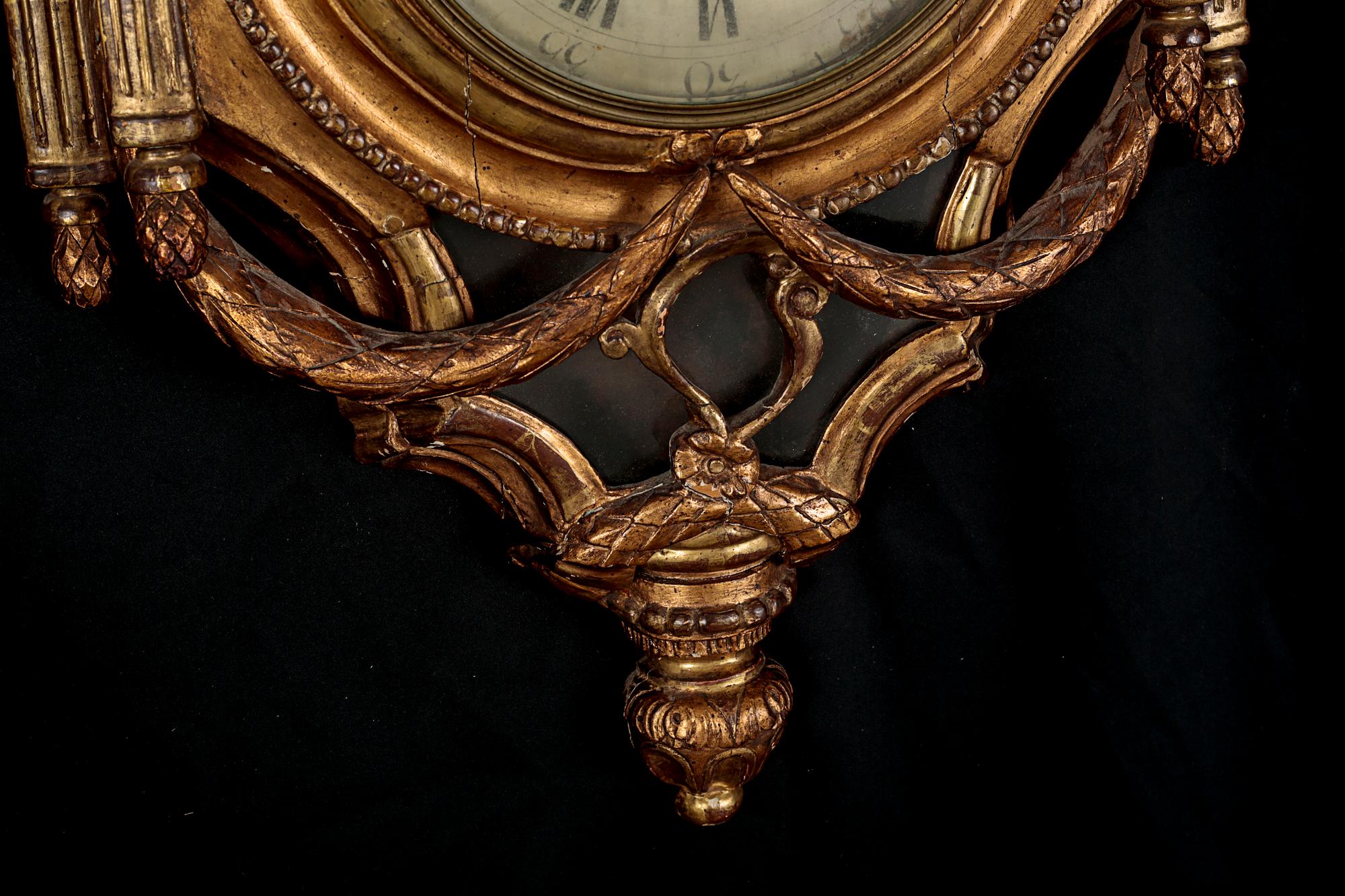 A Gustavian wall hanged clock, dial marked "Jacob Kock Stockholm", maded in the second half of the 18th century.
