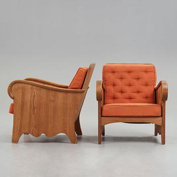 Axel Einar Hjorth, attributed, a pair of stained pine "Lovö" easy chairs, Nordiska Kompaniet, Sweden 1930's.