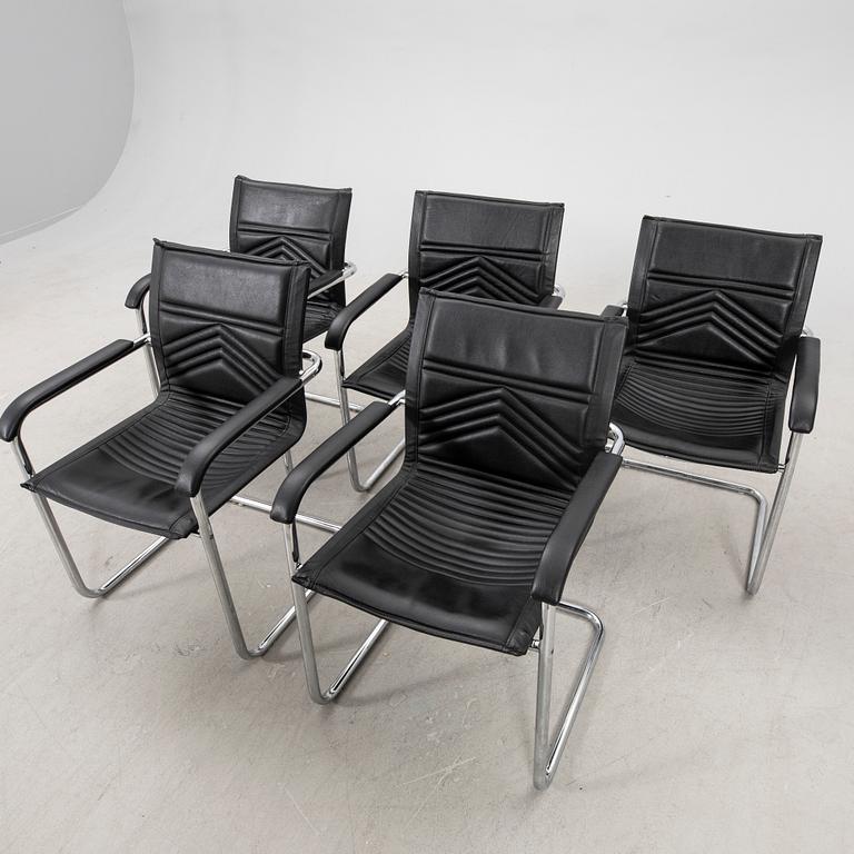 A set of five chrome and leather armchairs alter part of the 20th century.