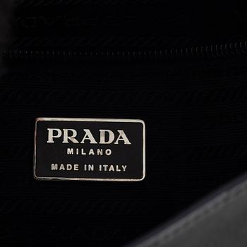 Prada, a dark grey leather bag.