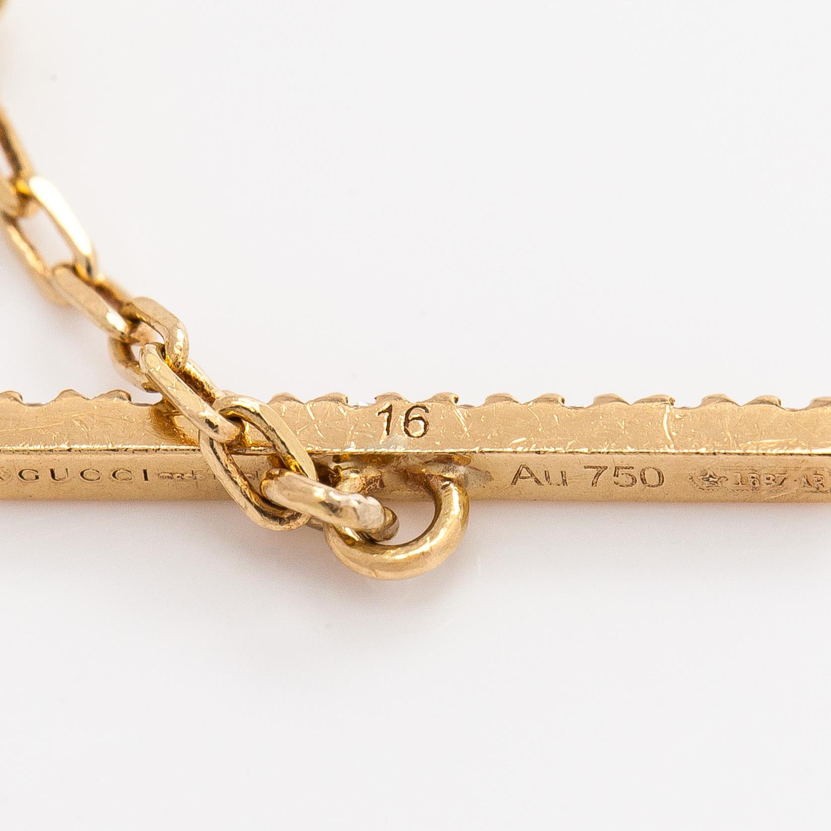 Gucci, an 18K gold 'Interlocking' bracelet with brilliant-cut diamonds.