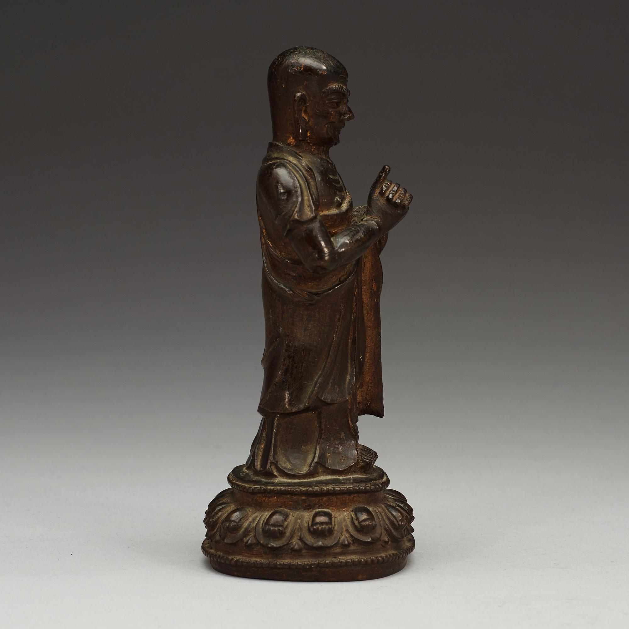 A bronze figure of a Lohan, Ming dynasty, 17th Century.