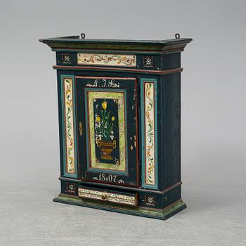 A painted wall cabinet, 19th century.