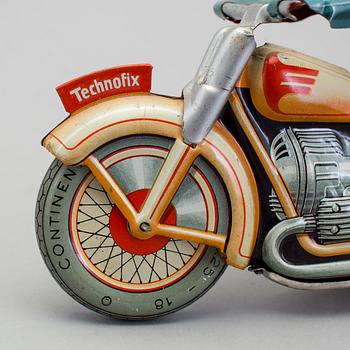 A Technofix tinplate Trick motorcycle, Germany, ca 1950.