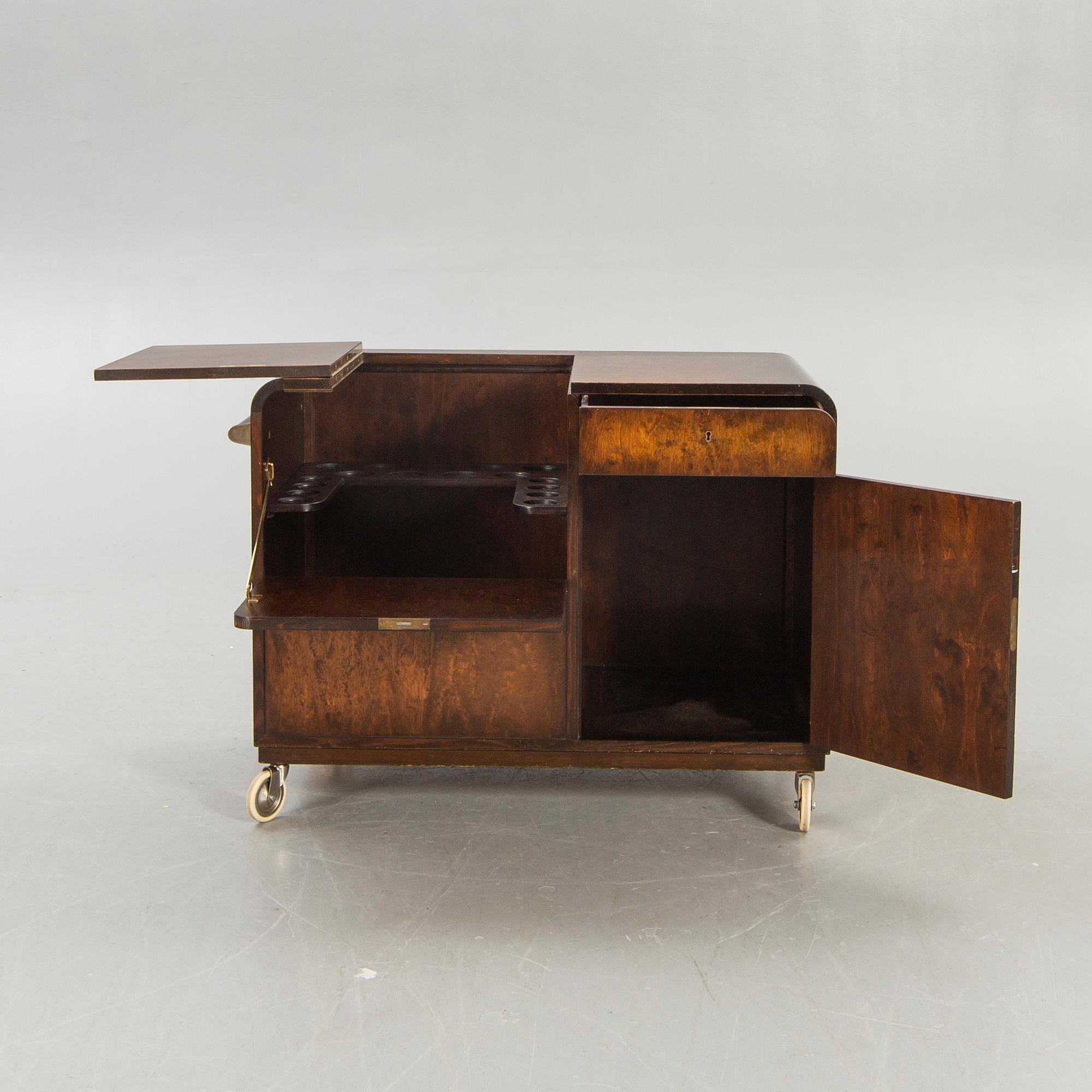 A stained birch bar cabinet from NK dated 1936.