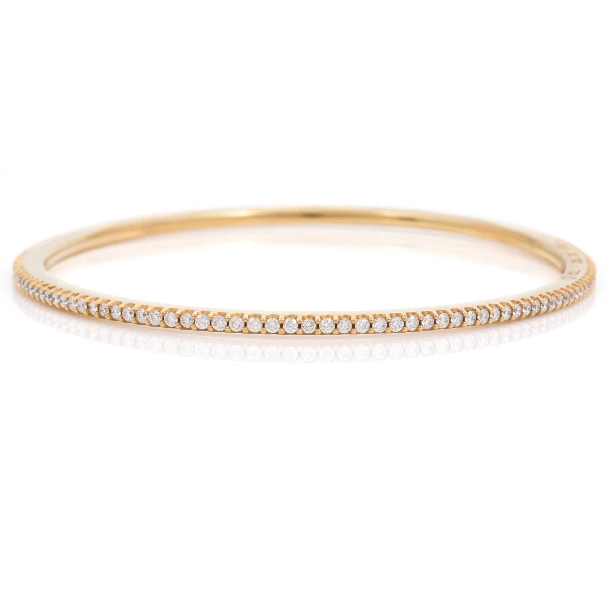 A brilliant cut diamond "Love bracelet" bangle by Ole Lynggard.