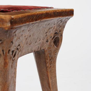Swedish Art Nouveau, a carved oak stool, early 1900s.