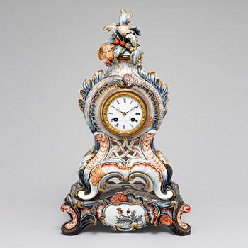 A new rococo creamware bracket clock, after Meissen model, early 20th century.