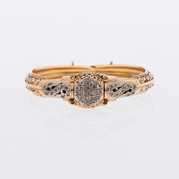 ARMBAND / ARMBANDSUR, 18K guld, åttkantslipade diamanter.