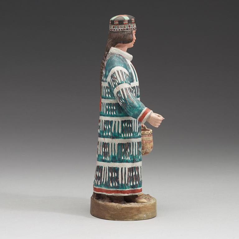 A Russian biscuit figure of a man of the Aleut people, circa 1900.