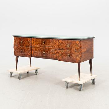 An Italian 1950s walnut sideboard.