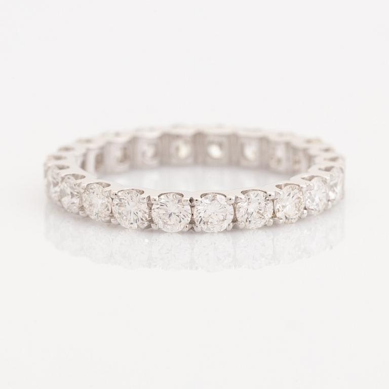 Brilliant-cut diamond eternity ring.