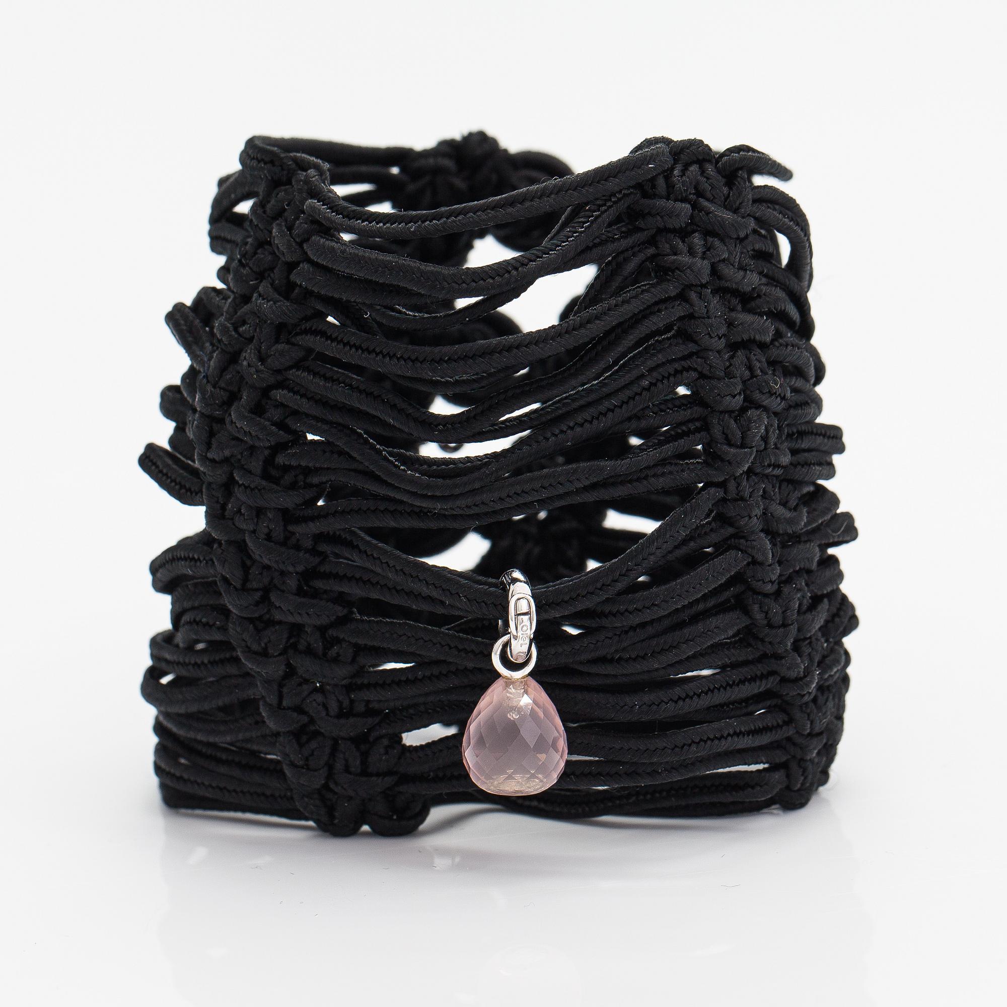Ole Lynggaard, A satin like band bracelet with an 18K white gold and rose quartz "Sweet drops" pendant.