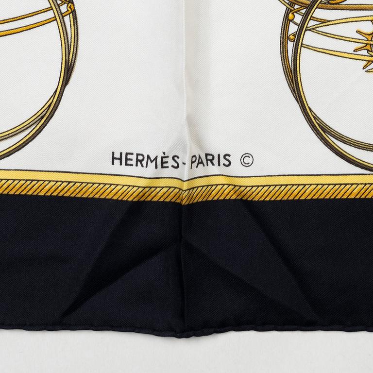 Hermès, a 'Les Voitures à Transformation' silk scarf.