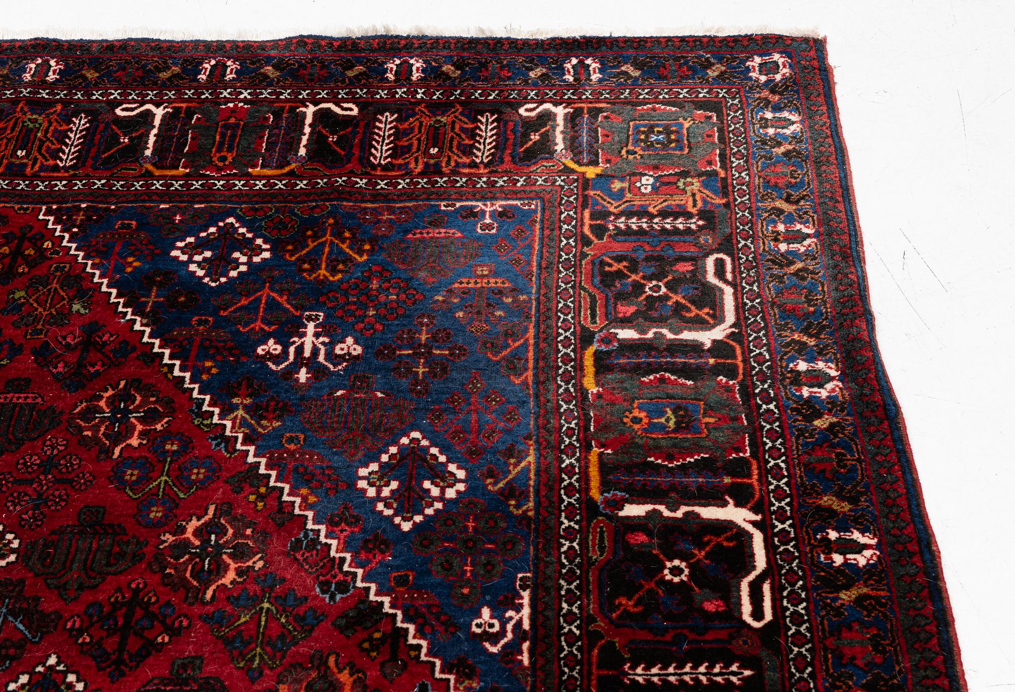 An oriental rug, c. 365 x 285 cm.