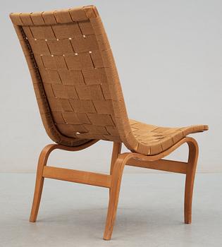 A Bruno Mathsson beech and canvas easy chair, 'Eva', Karl Mathsson, Värnamo, Sweden 1940's.