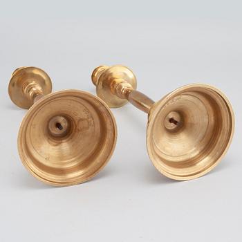 A pair of brass candlesticks from Skultuna, around the year 1900.