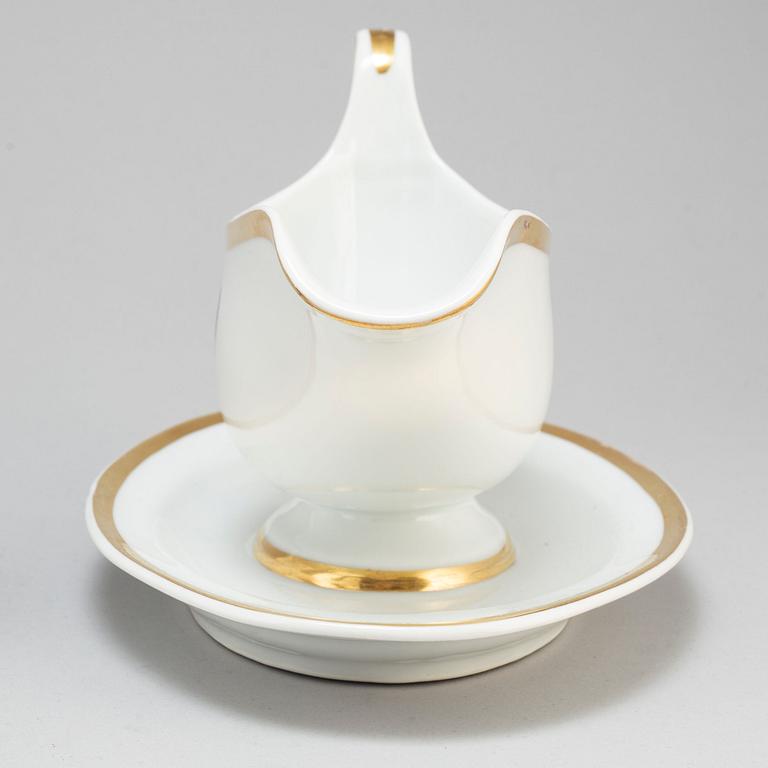 A first half of the 19th century porcelain plate and sauce boat, KPM, Berlin, Germany.