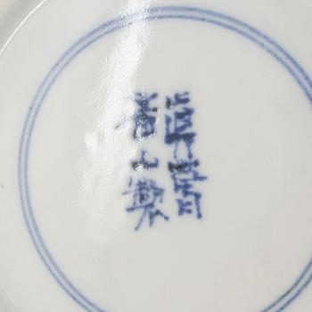 A Japanese teapot, teacup with saucer, and milk jug, porcelain, signed, 20th century.