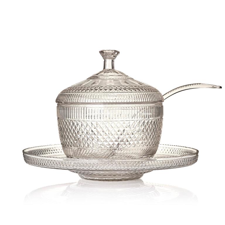 A cut glass punch bowl with cover, stand and ladle, Empire, first part of the 19th century.
