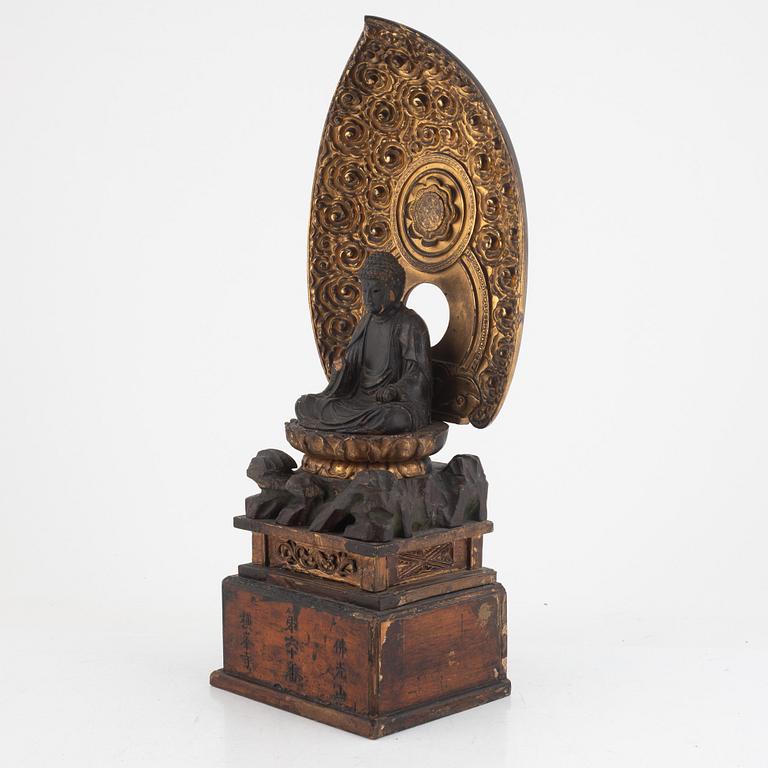 A Japanese lacquer and gilt-decorated wood Buddha Amida figure, Edo (1603-1867).