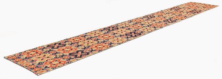 A bench cushion, flat weave, c. 344 x 51 cm, Herrestads district, Scania, Sweden, first half of the 19th century.