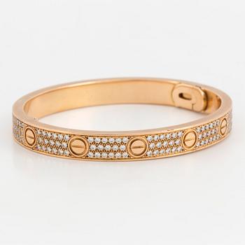 A Cartier 'LOVE' bangle set with round, brilliant-cut diamonds.