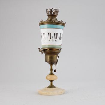 A night-light clock, late 19th century.